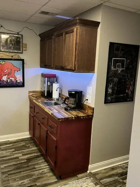 The finished wet bar seen from the seating side of the room.